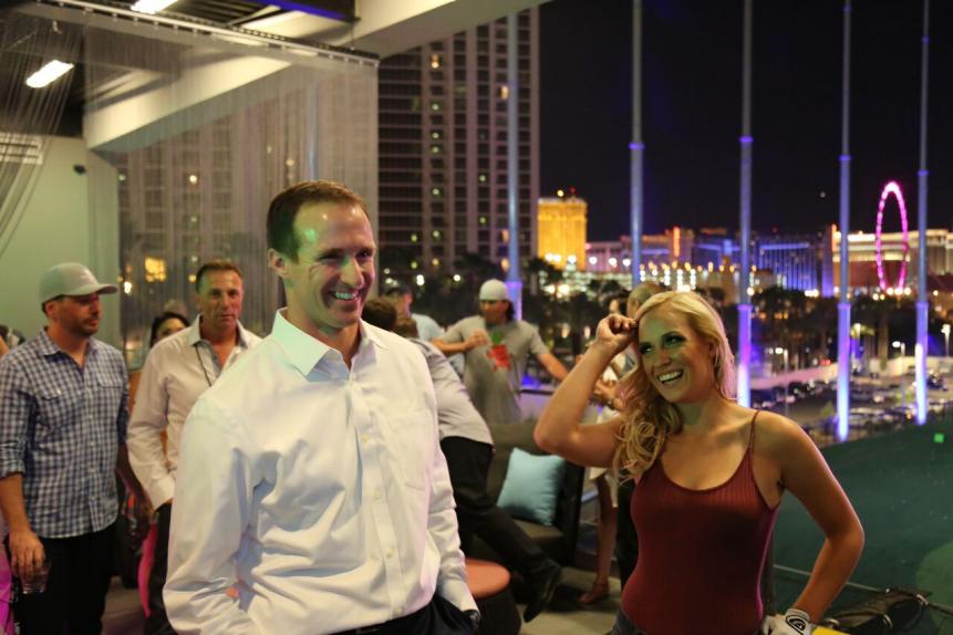 The grand-opening party attracted stars like Drew Brees, who lost to Paige in a one-on-one range duel.