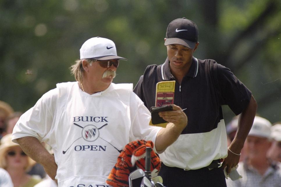 9 Aug 1997:  Mike (Fluff) Cowen speaks with Tiger Woods on the 18th hole during the Buick Open at Warwick Hills Country Club in Grand Blanc, Michigan. Mandatory Credit: Matthew Stockman  /Allsport