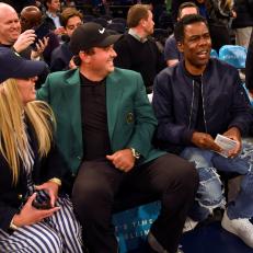 NEW YORK, NY - APRIL 09: Masters Champion Patrick Reed and his wife Justine are visited by comedian Chris Rock during the New York Knicks and Cleveland Cavaliers basketball game during the Masters winner media tour throughout New York City on April 9, 2018 in New York City, New York. (Photo by Stan Badz/PGA TOUR)