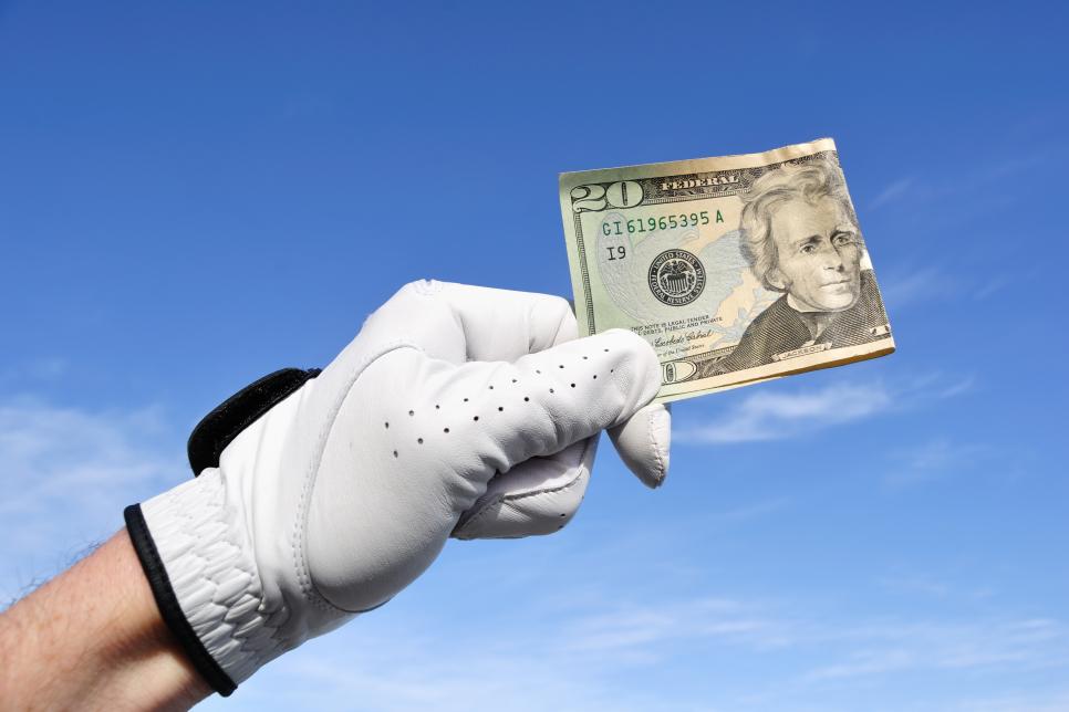 Golfer Holding a Twenty Dollar Bill
