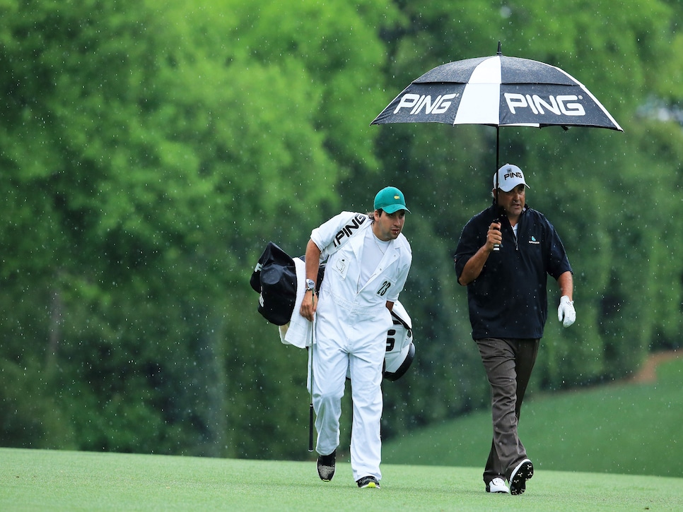 angel-cabrera-2013-masters-walking-rain-caddie.jpg