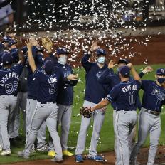 NEW YORK, NEW YORK - SEPTEMBER 23:  The Tampa Bay Rays celebrate an 8-5 win against the New York Mets as they clinch the American League East after their game at Citi Field on September 23, 2020 in New York City. (Photo by Al Bello/Getty Images)