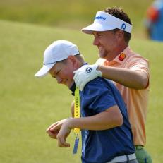 PORTRUSH, NORTHERN IRELAND - JULY 16: Ian Poulter of England shares a joke with his son Luke Poulter during a practice round prior to the 148th Open Championship held on the Dunluce Links at Royal Portrush Golf Club on July 16, 2019 in Portrush, United Kingdom. (Photo by Stuart Franklin/Getty Images)