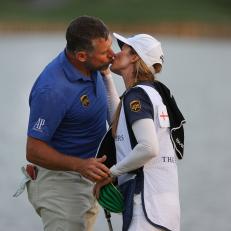 PONTE VEDRA BEACH, FLORIDA - MARCH 13: Lee Westwood of England kisses his caddie and partner Helen Storey after finishing on the 18th green during the third round of THE PLAYERS Championship on THE PLAYERS Stadium Course at TPC Sawgrass on March 13, 2021 in Ponte Vedra Beach, Florida. (Photo by Kevin C. Cox/Getty Images)