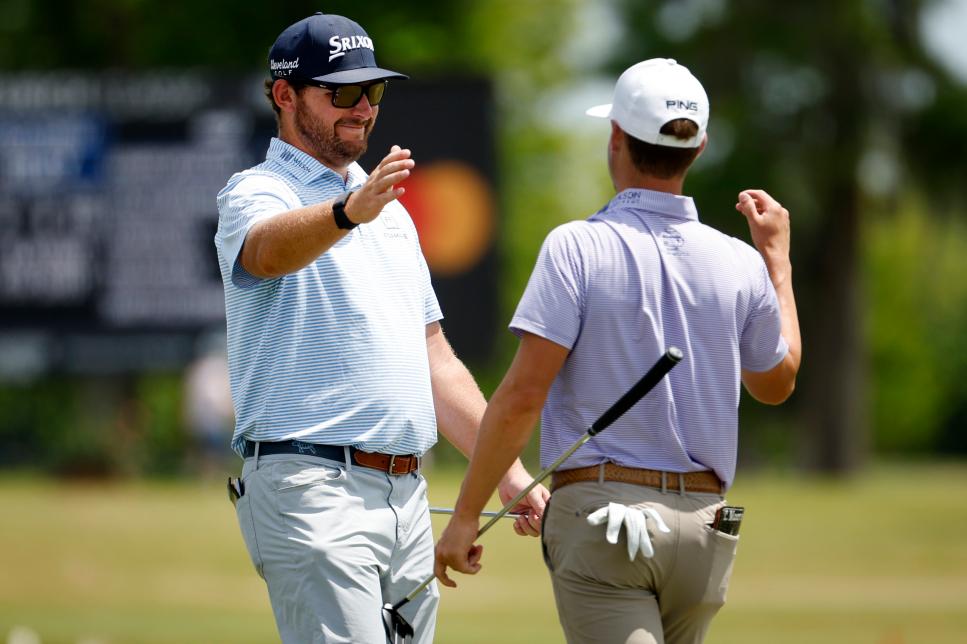 AVONDALE, LOUISIANA - APRIL 21: Matthew NeSmith and Taylor Moore react on the 18th green during the first round of the Zurich Classic of New Orleans at TPC Louisiana on April 21, 2022 in Avondale, Louisiana. (Photo by Chris Graythen/Getty Images)