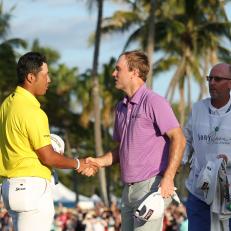 HONOLULU, HAWAII - JANUARY 16: Hideki Matsuyama of Japan shakes hands with Russell Henley of the United States on the 18th green after winning in a one-hole playoff during the final round of the Sony Open in Hawaii at Waialae Country Club on January 16, 2022 in Honolulu, Hawaii. (Photo by Gregory Shamus/Getty Images)
