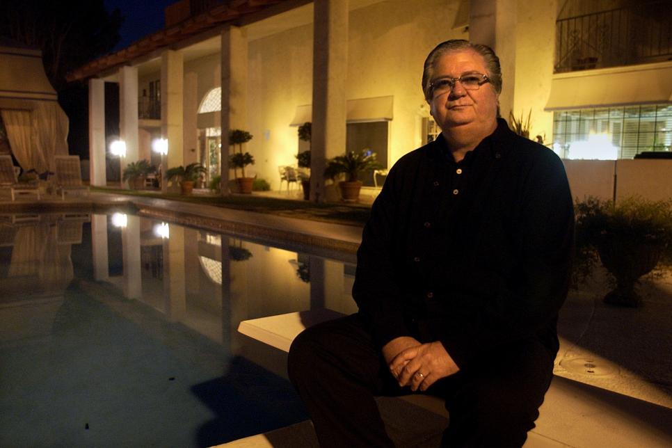 Billy Baxter sits next to his swimming pool at his Las Vegas mansion. Baxter has been known to bet one million dollars in one week on college and professional sports and has made a living out of it.  (Photo by Wally Skalij/Los Angeles Times via Getty Images)
