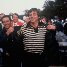 (Original Caption) Augusta, Georgia: Golfer Gary Player helps Master golf tournament winner Fuzzy Zoeller on with his green jacket.