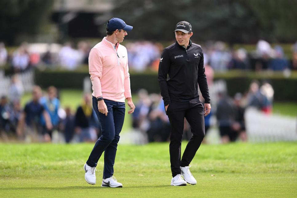 VIRGINIA WATER, ENGLAND - SEPTEMBER 10: Rory McIlroy of Northern Ireland talks with Matthew Fitzpatrick of England during Round Two on Day Three of the BMW PGA Championship at Wentworth Golf Club on September 10, 2022 in Virginia Water, England. (Photo by Ross Kinnaird/Getty Images)