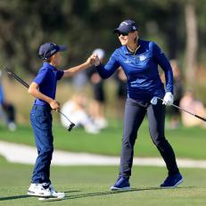 ORLANDO, FLORIDA - DECEMBER 18: Annika Sorenstam of Sweden fist pumps her son Will McGee as they walk down the 18th hole during the final round of the 2022 PNC Championship at The Ritz-Carlton Golf Club on December 18, 2022 in Orlando, Florida. (Photo by David Cannon/Getty Images)