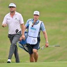 AUSTIN, TEXAS - MARCH 22: Keith Mitchell and his caddie walk along the 18th fairway during the first day of the World Golf Championships-Dell Technologies Match Play at Austin Country Club on March 22, 2023 in Austin, Texas. (Photo by Ben Jared/PGA TOUR via Getty Images)
