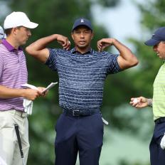 TULSA, OKLAHOMA - MAY 19: Tiger Woods and Jordan Spieth of the USA with Rory McIlroy of Northern Ireland during the first round of the USPGA Championship at Southern Hills Country Club on May 19, 2022 in Tulsa, Oklahoma. (Photo by Richard Heathcote/Getty Images)