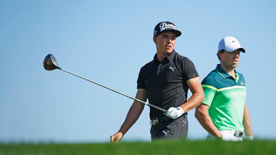 ABU DHABI, UNITED ARAB EMIRATES - JANUARY 15:  Rickie Fowler of the United States and Rory McIlroy of Northern Ireland wait together on the third hole during the first round of the Abu Dhabi HSBC Golf Championship at the Abu Dhabi Golf Cub on January 15, 2015 in Abu Dhabi, United Arab Emirates.  (Photo by Scott Halleran/Getty Images)