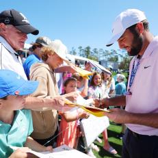 PONTE VEDRA BEACH, FLORIDA - MARCH 12: Scottie Scheffler of the United States signs autographs during a practice round prior to THE PLAYERS Championship on the Stadium Course at TPC Sawgrass on March 12, 2024 in Ponte Vedra Beach, Florida. (Photo by Kevin C. Cox/Getty Images)