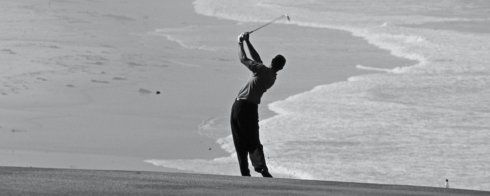1011208072 Tiger Woods of the United States silhouetted against the oceanside backdrop as he plays from the ninth fairway during the the 100th United States Open golf tournament on 14 June 2000 at the Pebble Beach Golf Course in Pebble Beach, Monterey, California. (Photo by Jonathan Ferrey/Getty Images)