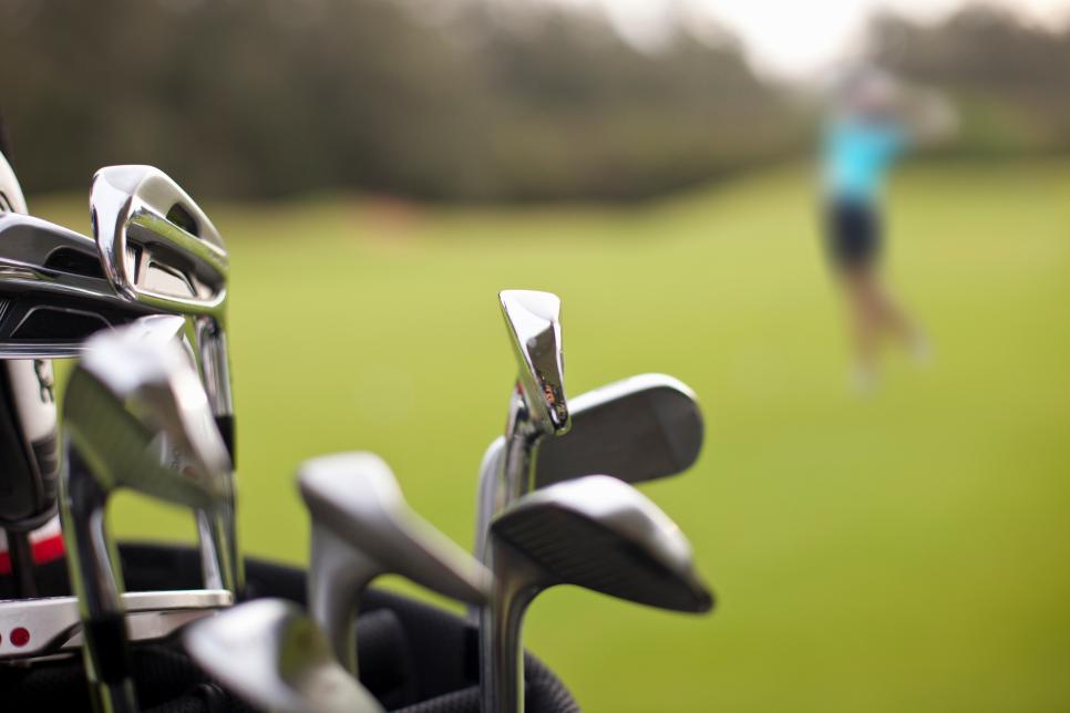 A set of golf clubs on the green
