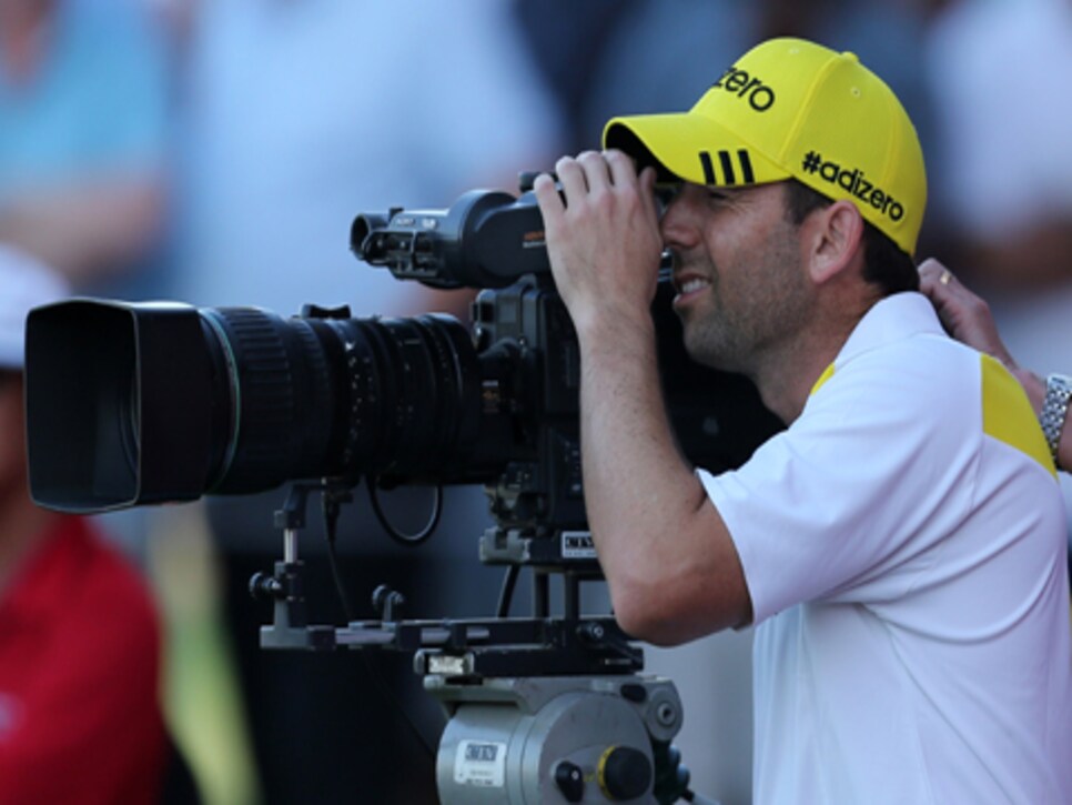 /content/dam/images/golfdigest/fullset/2015/07/20/55ad768cadd713143b427578_golf-tours-news-blogs-local-knowledge-sergio-garcia-with-camera.jpg