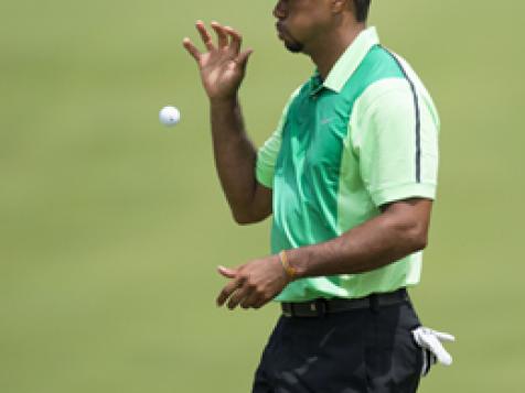 Woods' first round back takes 74 strokes, but at least he ends it in one piece
