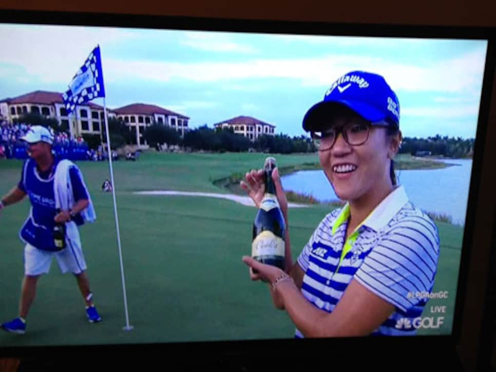 /content/dam/images/golfdigest/fullset/2015/07/20/55ad7dc7b01eefe207f7248f_blogs-the-loop-blog-lydia-ko-champagne-1125.jpg