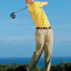 *by Ron Kaspriske*



When analyzing Zach Johnson\'s swing -- to see why he was in the top eight in driving accuracy on the PGA Tour in 2007 and \'08 -- it\'s best to start at the finish and work backward.



"There are a lot of players who can do what Zach does from backswing to impact," says his teacher, Mike Bender, "but not a lot who can do what he does from impact to follow-through."



Specifically, getting the right arm and shaft on nearly a straight line pointing at the target after impact (frame 7). There\'s no early re-hinging of the club -- a move you see in a lot of players. Bender says Johnson\'s follow-through is reminiscent of Ben Hogan\'s and a big reason Johnson doesn\'t miss many fairways. "When you get the right arm and shaft on a straight line like that, it keeps the clubface square and on line longer," Bender says.



It\'s a follow-through that was grooved out of necessity, says Johnson. His average driving distance of 275 yards in 2008, for example, ranked 181st out of 195 PGA Tour players. So his best chance of competing at the highest level is to control the ball off the tee. That strategy has paid off: Including his Masters triumph in 2007 and a victory at the Sony Open in Hawaii in January, he has had four tour wins and 10 top-10 finishes the past two years.



"Obviously you want to swing harder to get it farther out there," Johnson says, "but for me it\'s all about position. The smoother I swing, the more opportunities I\'ll have for birdies."







Johnson knows he\'ll never be as long as the big-hitters, but he has worked with Bender to squeeze extra yardage out of his tee shots.

 "Over the years he had shifted his hands back in his setup," Bender says. "He could still hit golf shots with his hands back, but I showed him how much more solid he could hit the ball with his hands forward. So we\'ve moved them up, and he\'s having his best year ever in terms of ball striking.