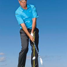 How To Flop It: Keep the clubhead low through impact, and let it pass your hands.