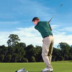 Swing and miss: A soft headcover just to the outside of the ball can help your swing path.