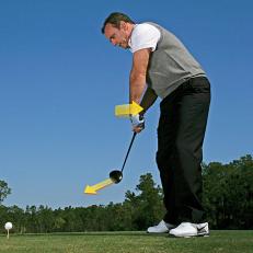 Roll Your Arms: For more swing speed, rotate your forearms as you start the downswing.