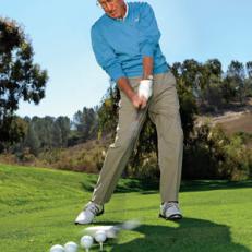 GET STARTED: To gain a sense of swinging the club with support from your feet and legs, begin by hitting a line of balls in a continuous motion.