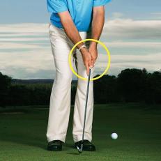 Point And Chip: For solid contact, extend your index finger, then keep it pointed back through impact.