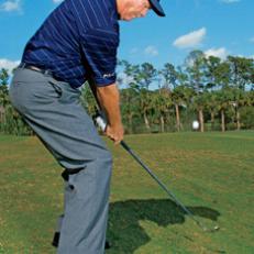 Ball below: Aim left of your target, and swing easier.