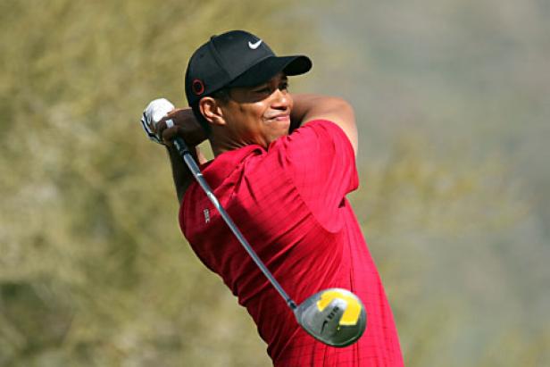 Tiger Woods struggles on a cool, wet 30-hole day that left 