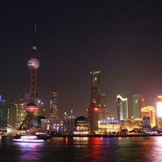 Shanghai nights: China\'s largest city, much of which has been built within the last decade, represents the transition from the austerity of Communist life to the modernity of a nation on the move.
