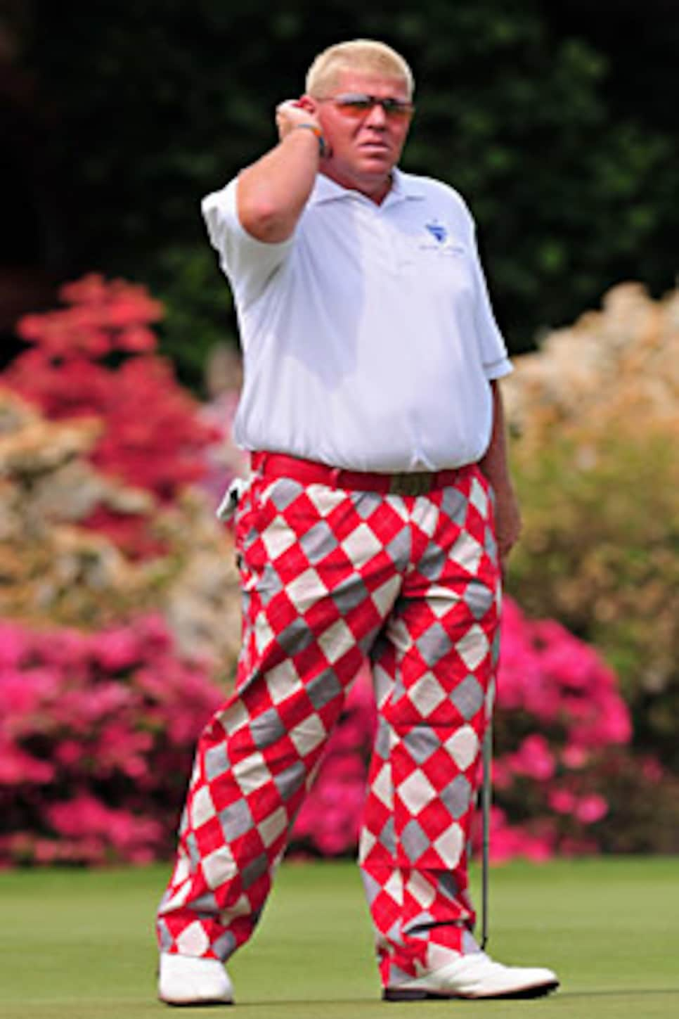 John Daly wears Hooters trousers and puffs on cigarette on 16th