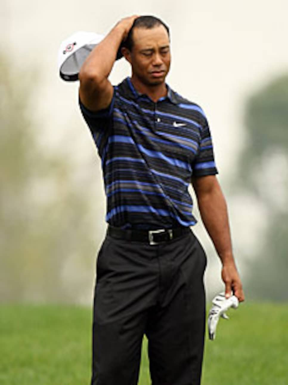 golfworld-2009-12-gwar01_1211tiger_sirak.jpg