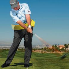 According to Butch Harmon, a quick fix to the dreaded hook is to spend some time on the driving range hitting drives at only half. This moves the player away from an overly fast arm swing. "Practice swinging your arms a little slower and turning your body more aggressively to the finish. Make sure you transfer your weight to your front foot coming down and turn your lower body to face the target. Get your hips turning all the way through, and you\'ll stop the face from snapping closed on the ball."

 More: [Strike Your Irons Solid](http://www.golfdigest.com/golf-instruction/2012-11/butch-harmon-solid-iron-shots), by Butch Harmon