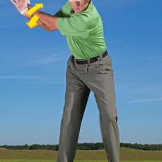 FEEL THE WINDUP: Cross your hands and pull in opposite directions as you swing back.