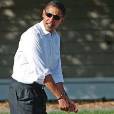 Cinderella story: Obama, a left-hander, mimics his stance last October at the Maumee Bay Resort in Ohio.