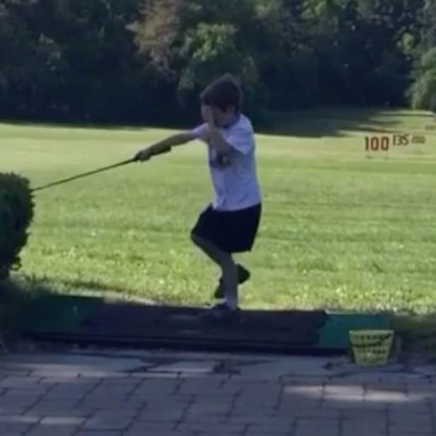 We can't stop watching this kid hit himself in the face with a golf