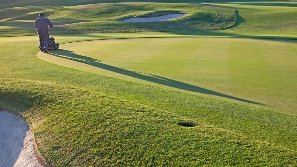 Immigration-golf-course-worker-cutting-grass.jpg