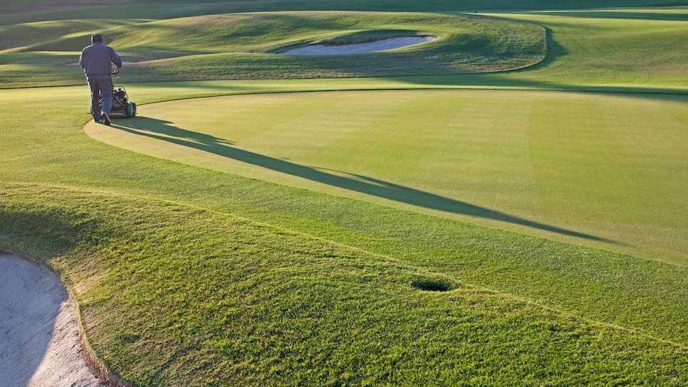 Immigration-golf-course-worker-cutting-grass.jpg