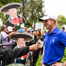 MEXICO CITY, MEXICO - MARCH 04:  Justin Thomas speaks during an interview as fans hold posters of Rory McIlroy and Phil Mickelson behind him during the third round of the World Golf Championships-Mexico Championship at Club de Golf Chapultepec on March 4, 2017 in Mexico City, Mexico. (Photo by Keyur Khamar/PGA TOUR)