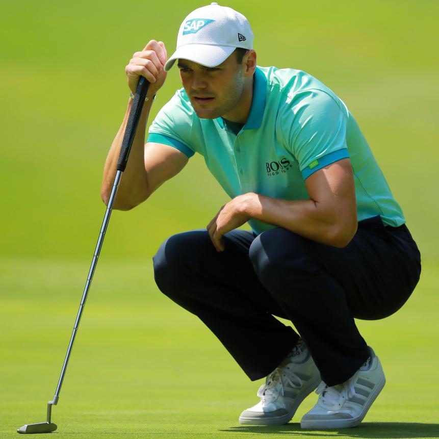Martin Kaymer paired his minty-green Hugo Boss polo with navy trousers to build a classic, sophisticated look.