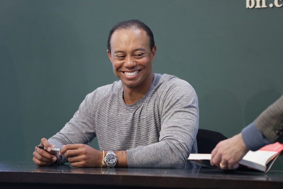 Tiger Woods Signs Copies Of His New Book "The 1997 Masters: My Story"