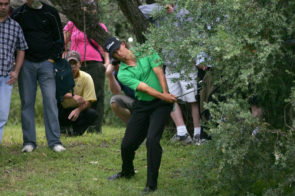 Golf - 2005 Mastercard Masters, Huntingdale. Adam Scott hits out of the trees o