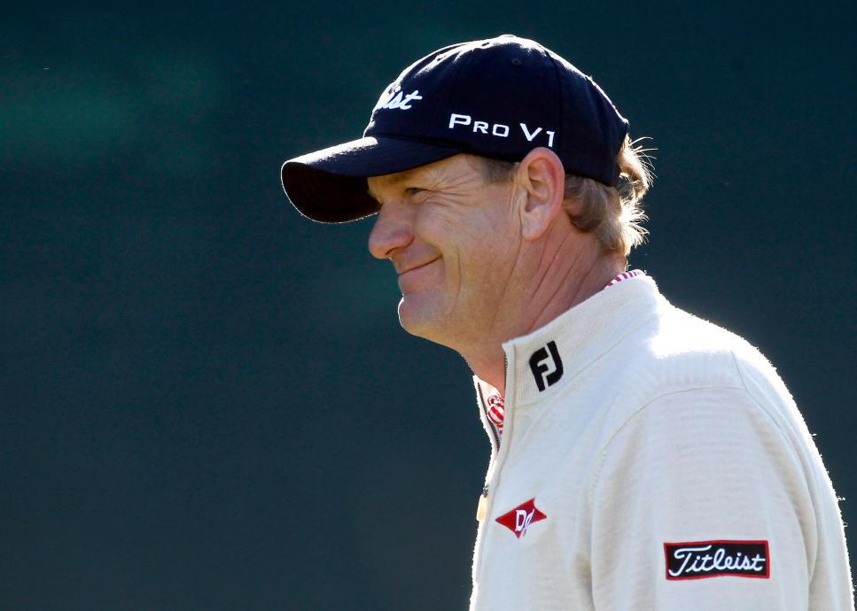 Tom Gillis smiles after getting a cheer from the crowd after a tee shot onto the 16th green during the first round of the Phoenix Open PGA golf tournament Thursday, Feb. 3, 2011, in Scottsdale, Ariz. Gillis shot a 6-under-par 65 and is tied for the lead. (AP Photo/Ross D. Franklin)