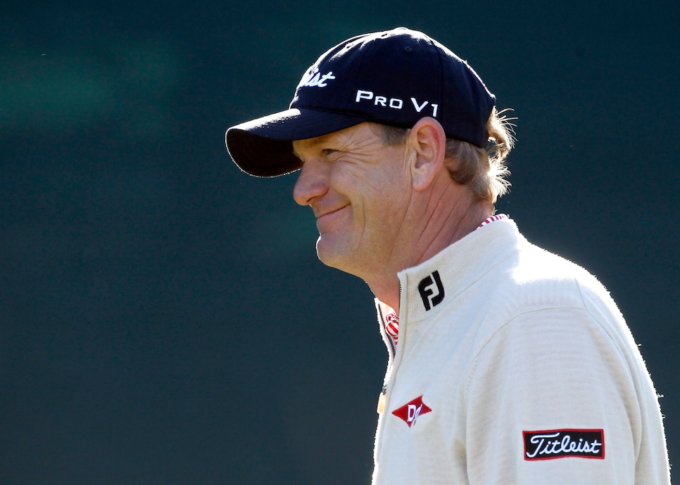 Tom Gillis smiles after getting a cheer from the crowd after a tee shot onto the 16th green during the first round of the Phoenix Open PGA golf tournament Thursday, Feb. 3, 2011, in Scottsdale, Ariz. Gillis shot a 6-under-par 65 and is tied for the lead. (AP Photo/Ross D. Franklin)