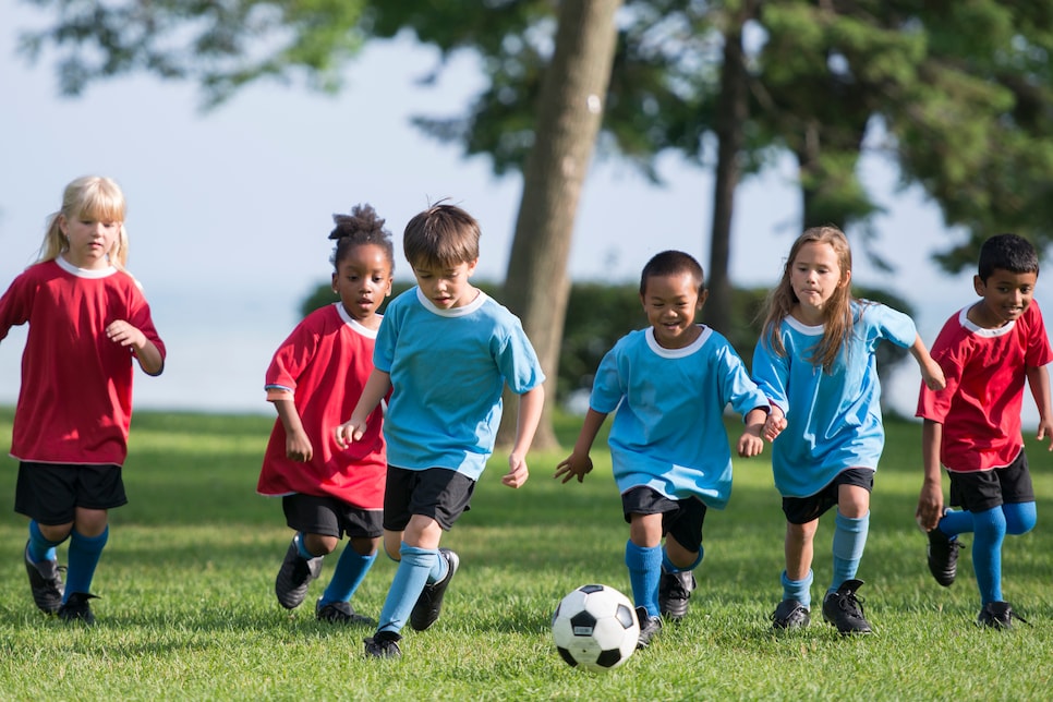 Little Boy Kicking a Soccer Ball