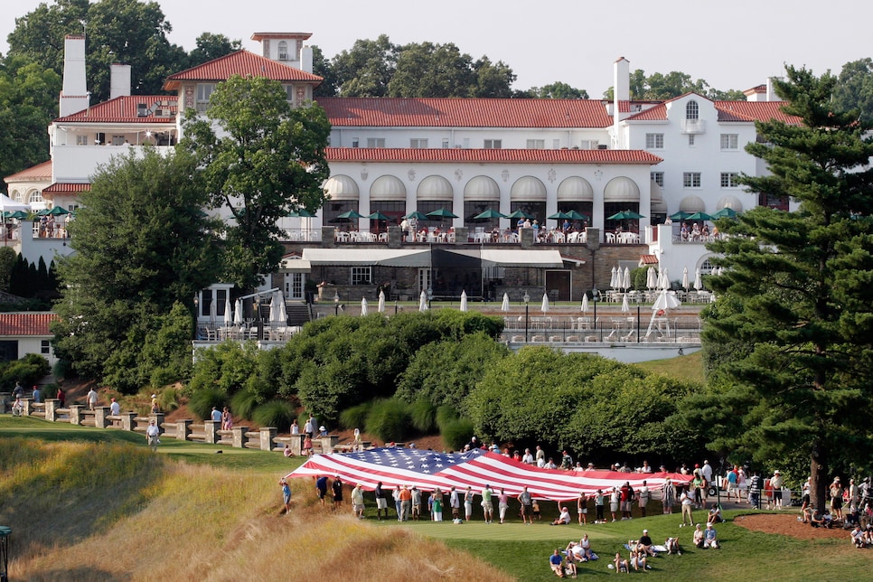 An American flag is unfurled near the clubhouse during the f