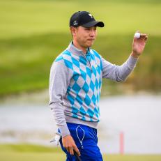 INCHEON CITY, SOUTH KOREA - OCTOBER 10:  Sangmoon Bae of Korea on the International Team celebrates and waves his ball to fans after saving par on the ninth hole green during morning foursomes in the third round of The Presidents Cup at Jack Nicklaus Golf Club Korea on October 10, 2015 in Songdo IBD, Incheon City, South Korea. (Photo by Chris Condon/PGA TOUR)