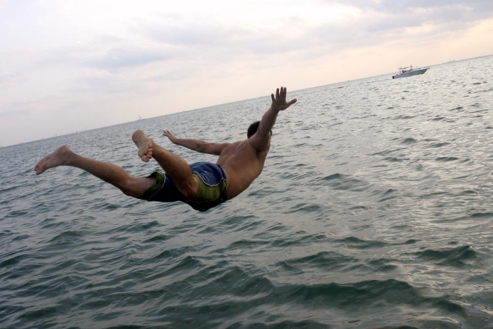 man diving in ocean